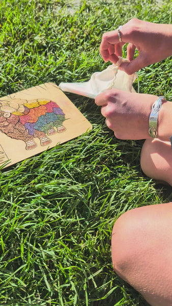 Each puzzle kit comes with a musk ox puzzle, a pack of 12 colored pencils, a pencil sharpener, and a cotton cinch bag.